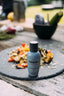 Tabac Original Craftsman Eau de Toilette steht auf Platte mit Essen.